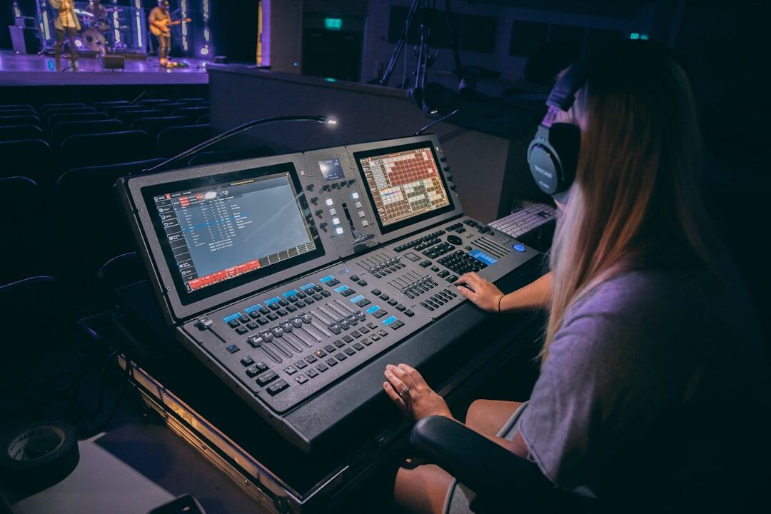 Broadcast engineer working at a video routing console